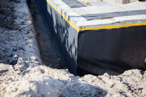 Professional Exterior Waterproofing technician working in East Pembroke, NY